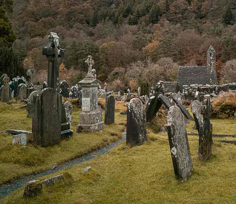 Tombstones in St Kevin's Church graveyard .